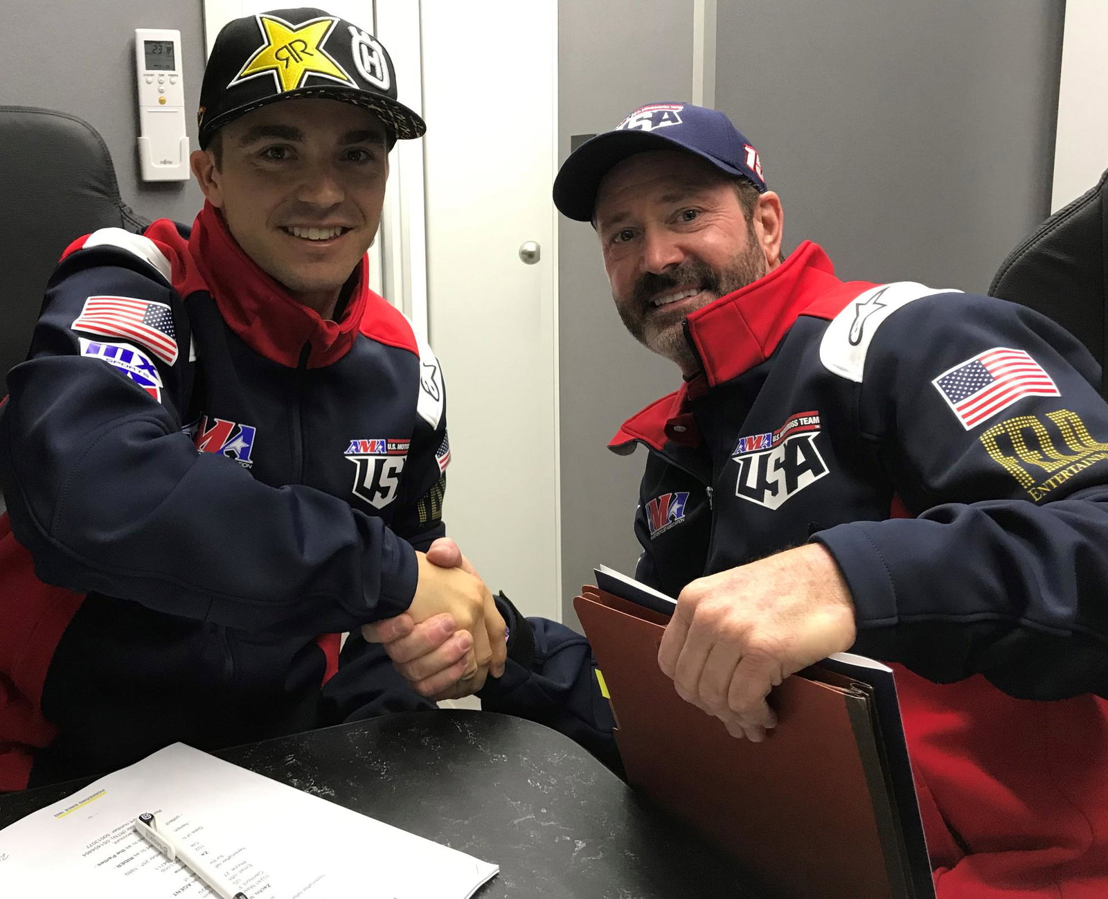 Osborne (left) and team manager Bobby Hewitt made the contract extension official at the Motocross of Nations in September.